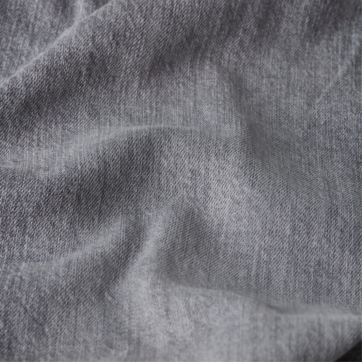 Close-up view of denim fabric texture for Mosa straight jeans.