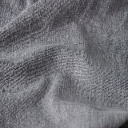 Close-up view of denim fabric texture for Mosa straight jeans.