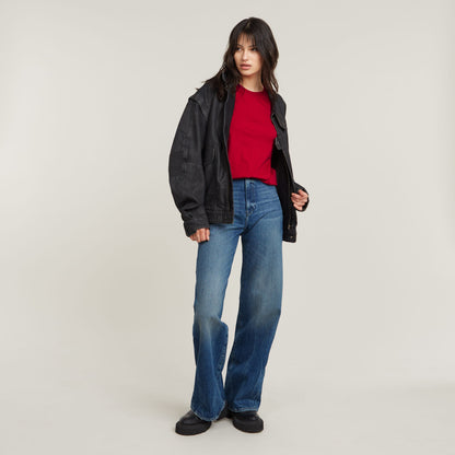 Top Front Seam t-shirt worn with a black jacket and blue flared jeans, showcasing a casual stylish look.