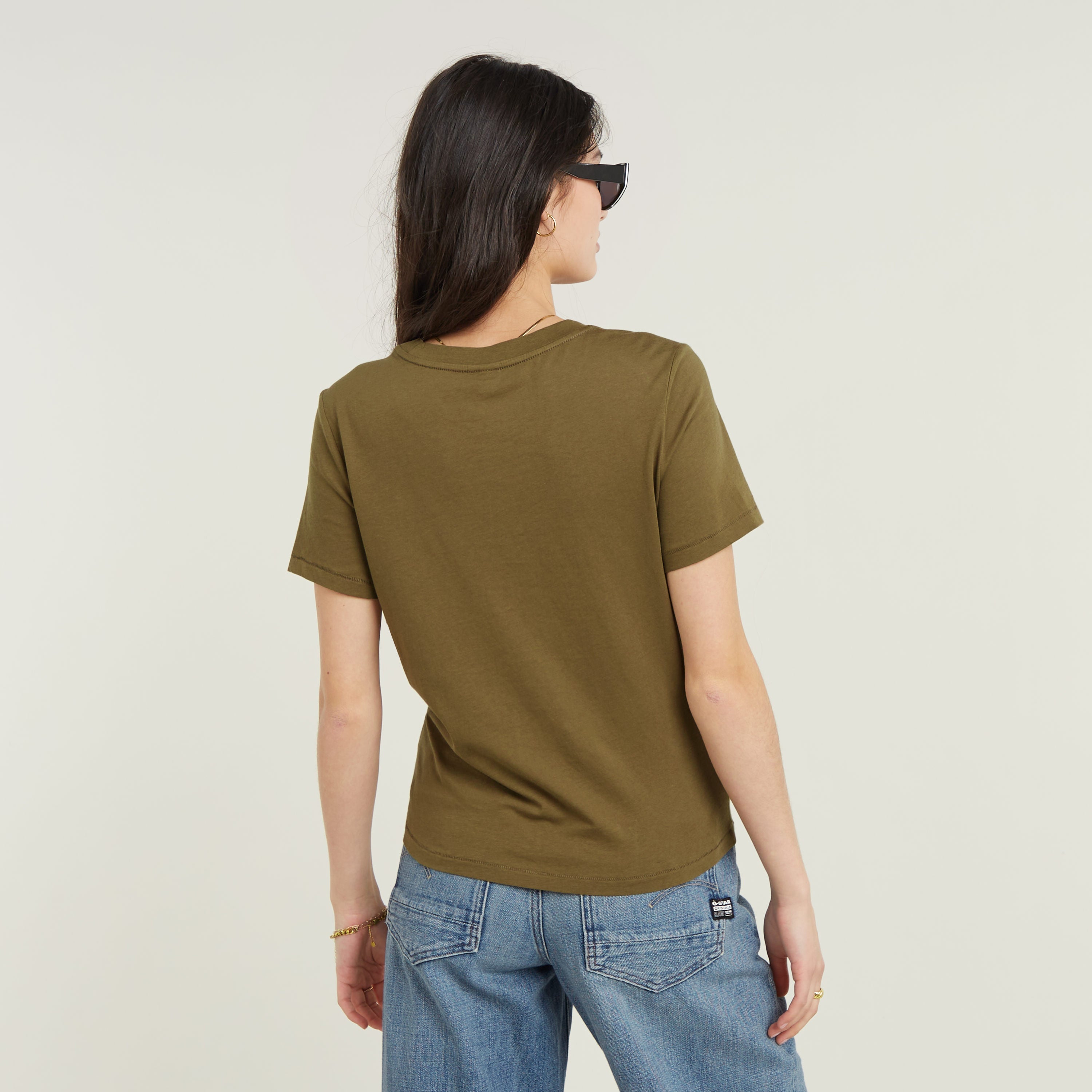 Eco-friendly front seam top, back view, featuring soft fabric and casual style in olive green.
