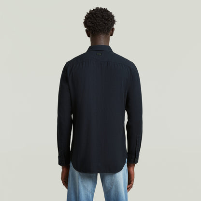 Camisa Marine Slim azul vista trasera en color azul oscuro con textura ligera y ajuste ajustado.