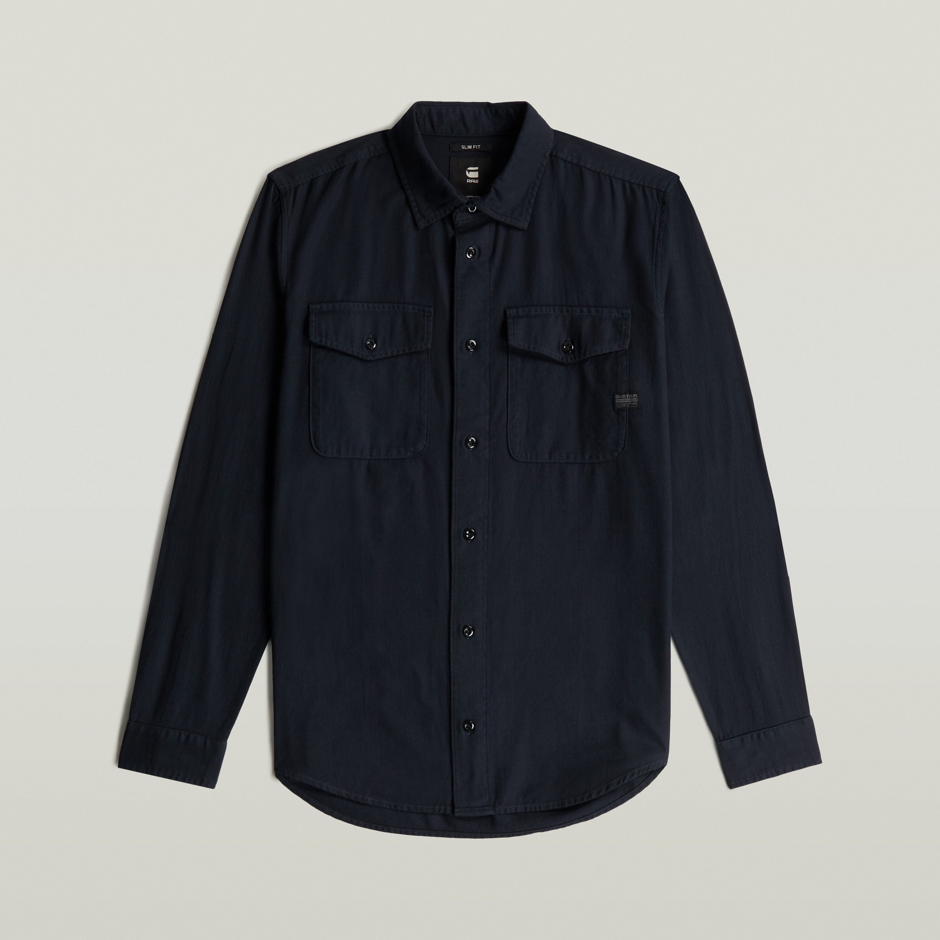 Camisa Marine Slim azul con corte ajustado y bolsillos en el pecho, color azul oscuro.