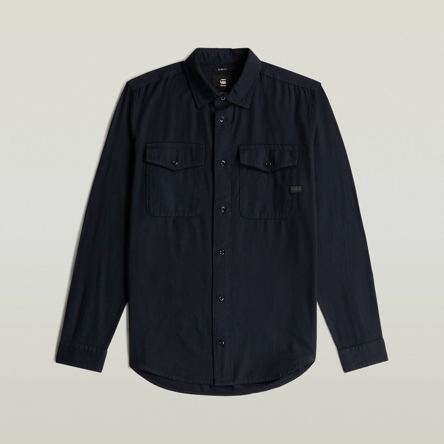 Camisa Marine Slim azul con corte ajustado y bolsillos en el pecho, color azul oscuro.