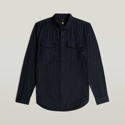 Camisa Marine Slim azul con corte ajustado y bolsillos en el pecho, color azul oscuro.