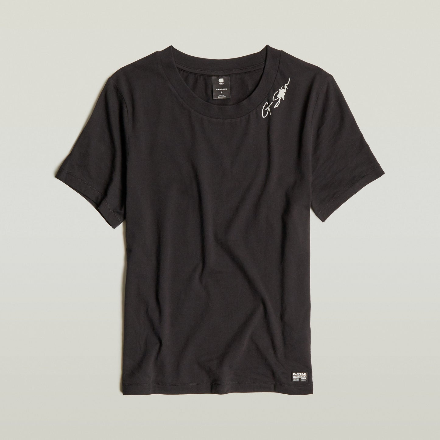 Top Faux Embro Logo, black t-shirt featuring a faux embroidered logo and soft cotton fabric.