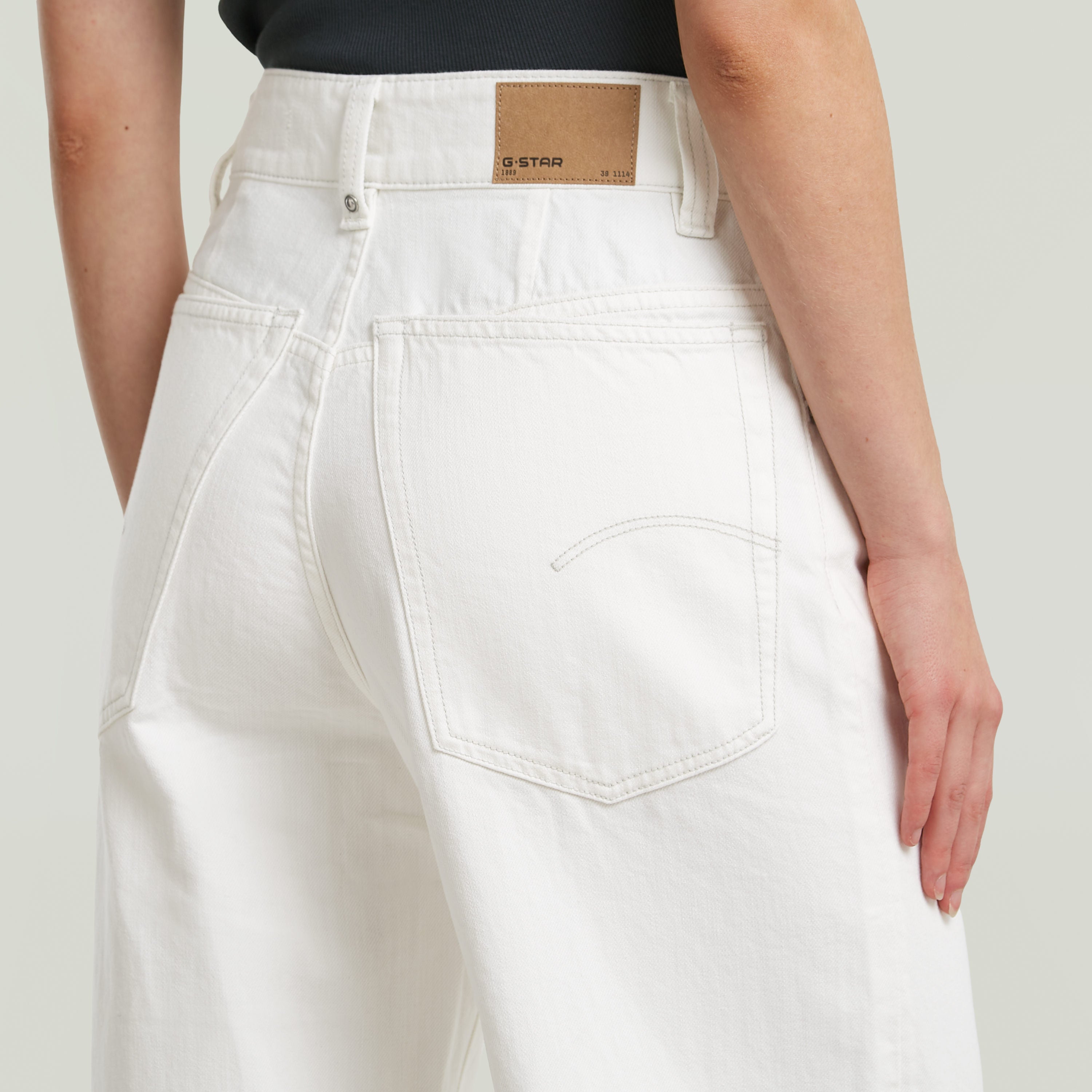 High loose skater jeans featuring deep back pockets and innovative seam details.
