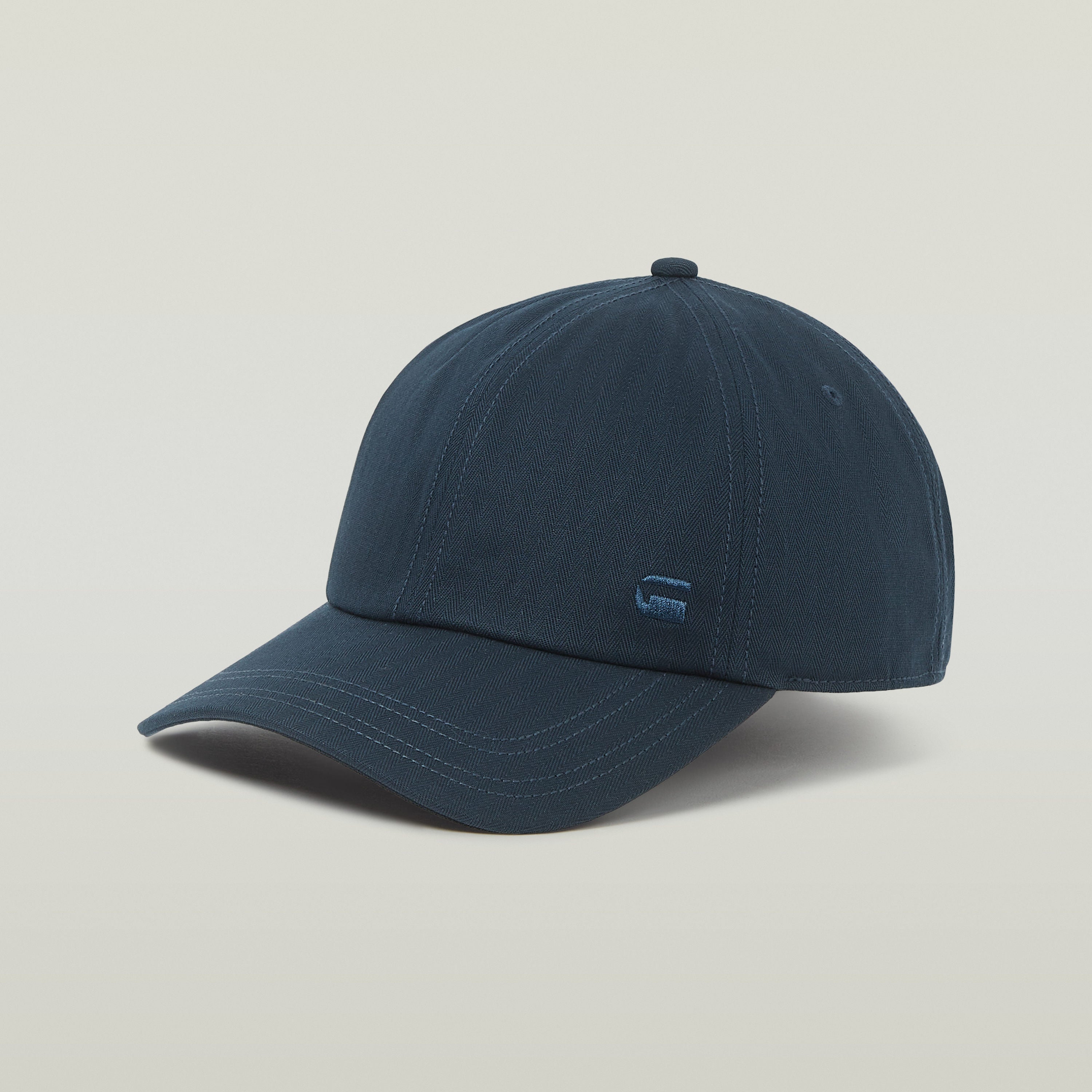 Gorra de béisbol Avernus con diseño de seis paneles y visera curvada en color azul.