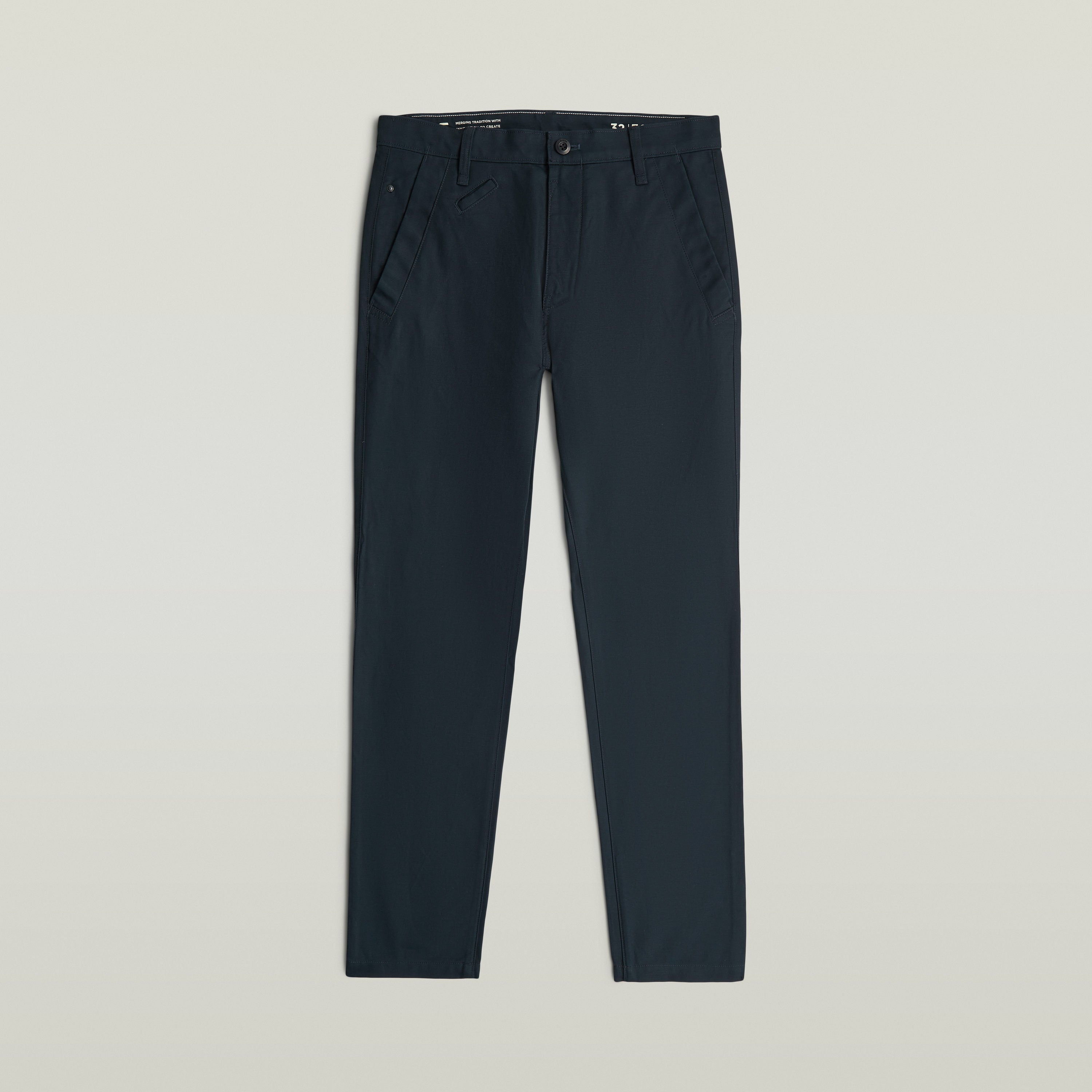 Bronson 3.0 slim chino pants displayed in a dark color with a sleek design and functional pockets.