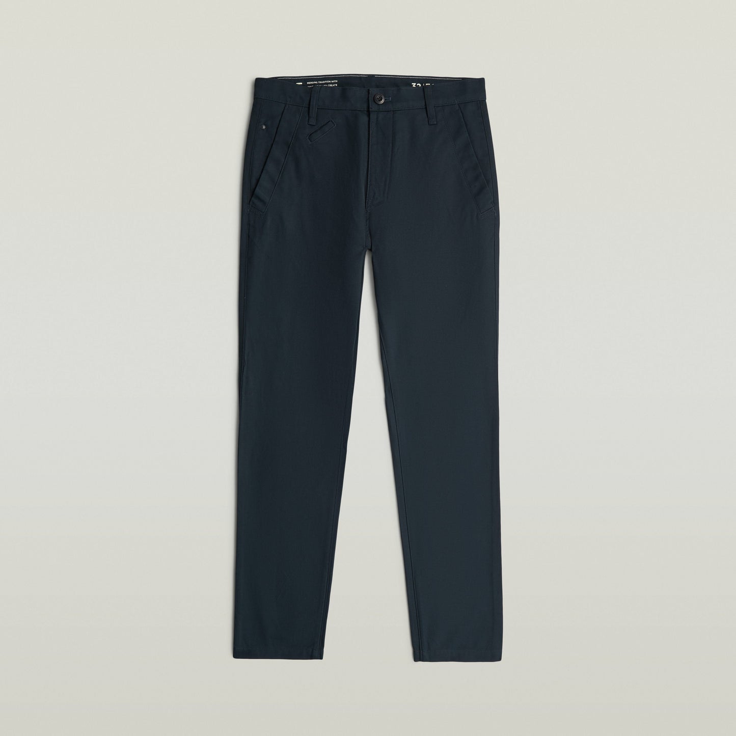 Bronson 3.0 slim chino pants displayed in a dark color with a sleek design and functional pockets.