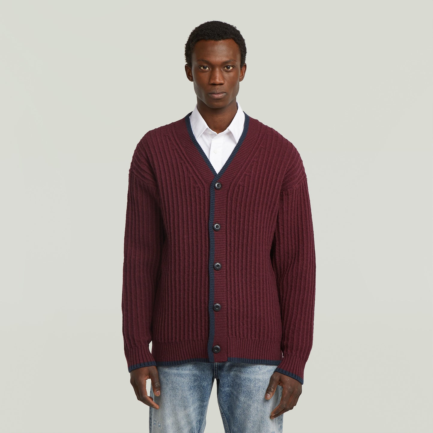Men's V-neck cardigan knit in burgundy color, featuring long sleeves and buttons for a stylish look.