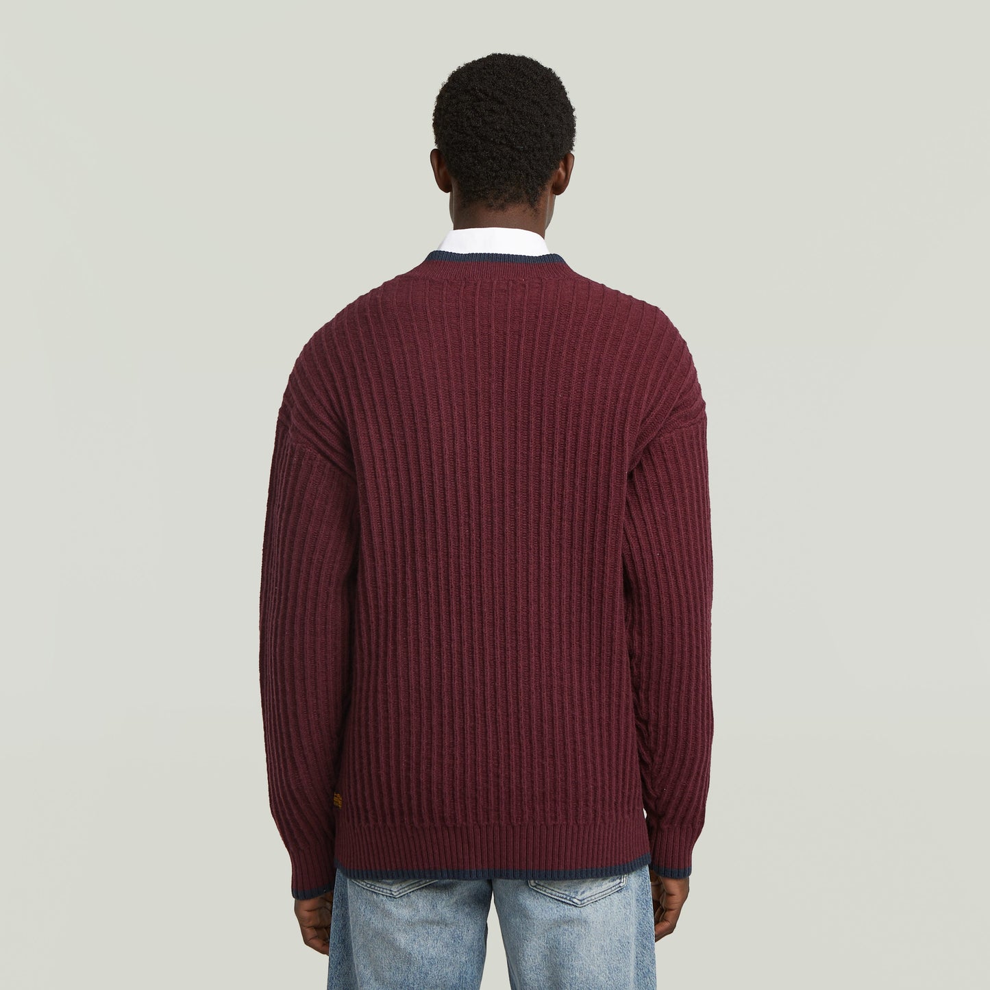 men's V-neck cardigan knit in a burgundy ribbed design, viewed from the back.