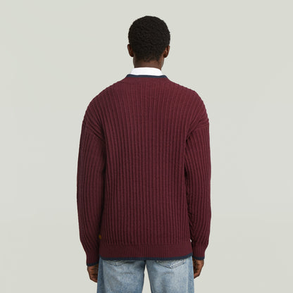 men's V-neck cardigan knit in a burgundy ribbed design, viewed from the back.