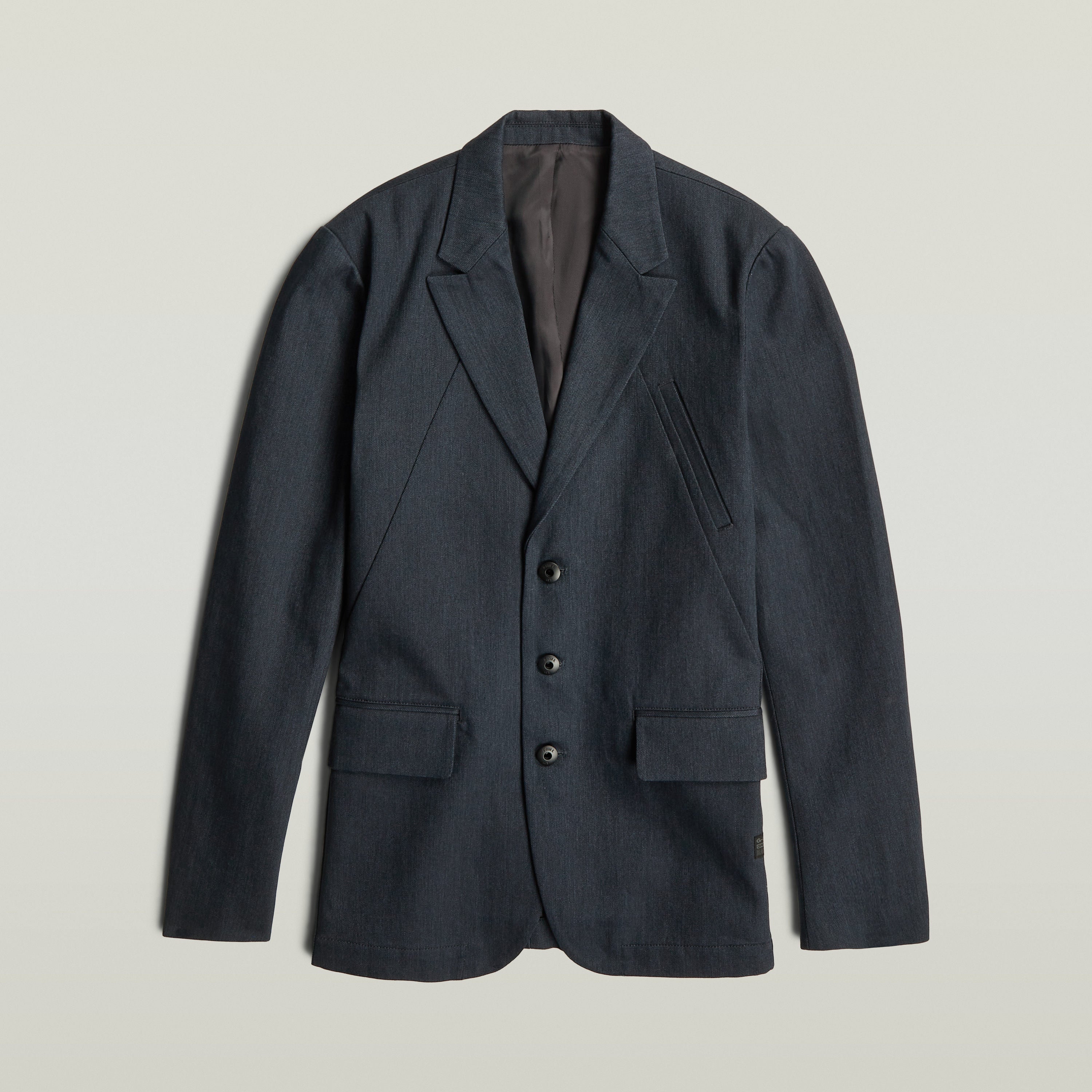 A-Line tailored denim blazer in dark blue, featuring a classic button closure and structured silhouette.