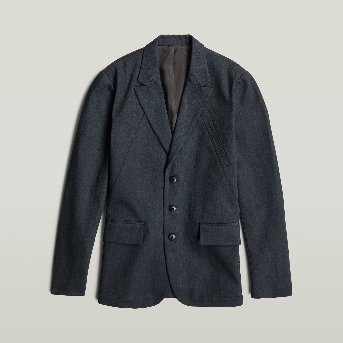 A-Line tailored denim blazer in dark blue, featuring a classic button closure and structured silhouette.