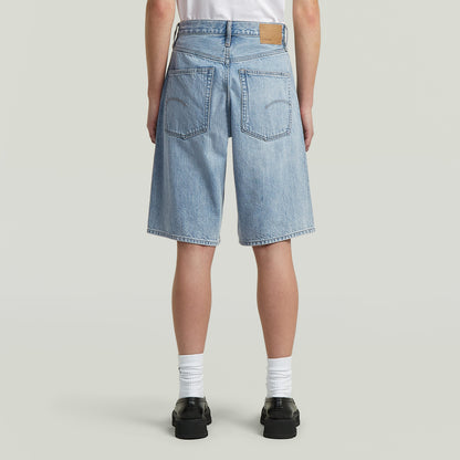 Bermuda shorts clean edge showing the back view with wide fit and knee-length cut.