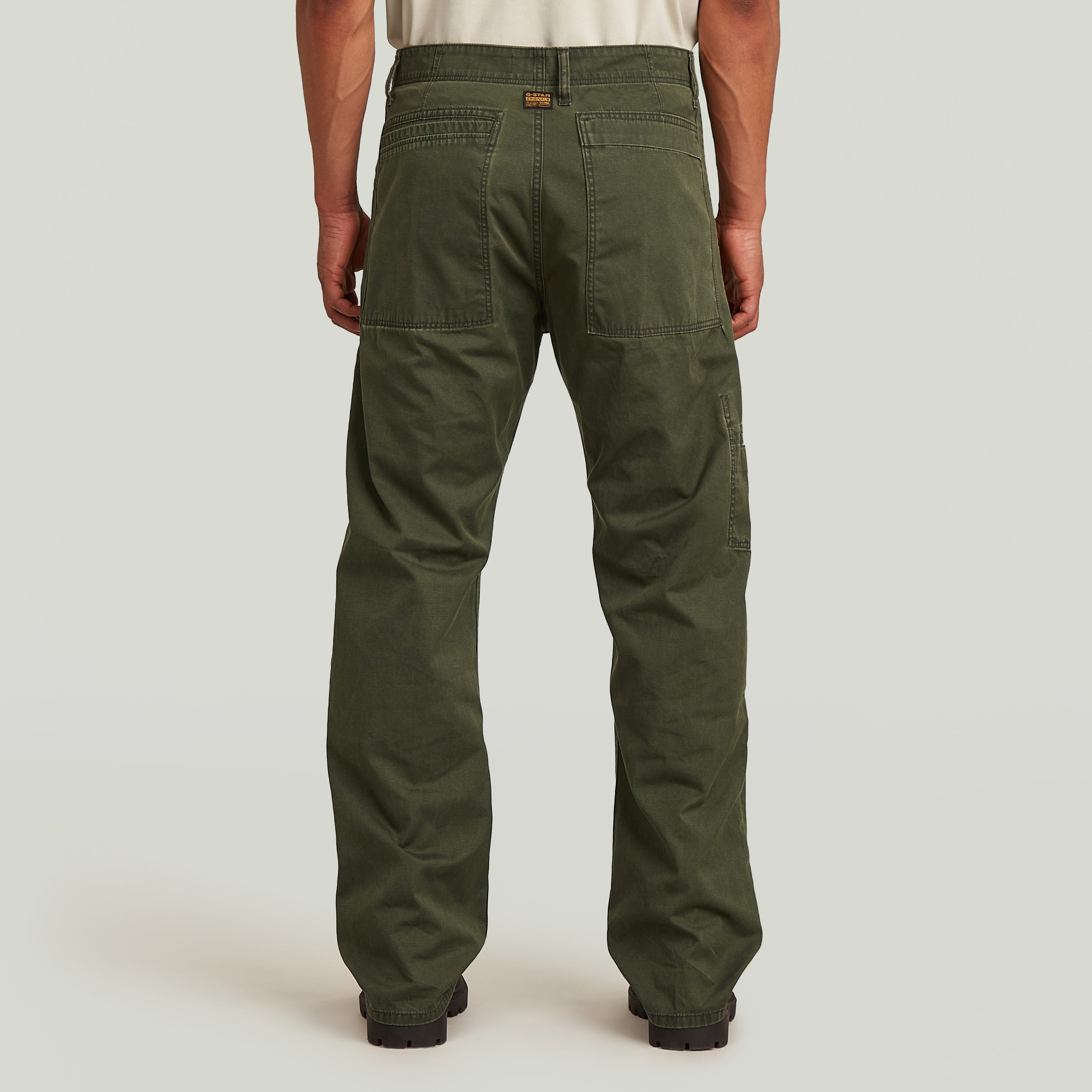 Reversible relaxed straight chinos in green, showcasing a relaxed fit and rear pockets, ideal for casual wear.