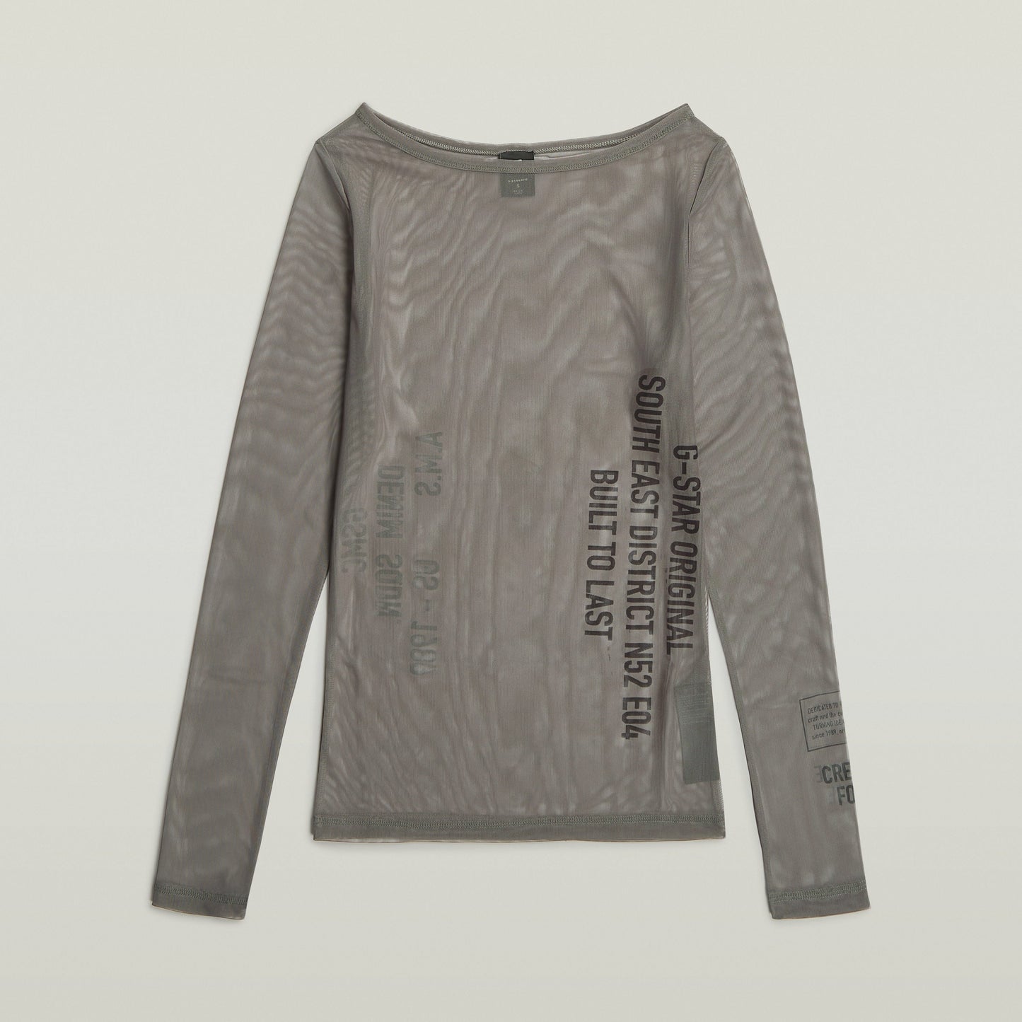 Camiseta slim con detalle gráfico de manga larga y cuello redondo en color gris.