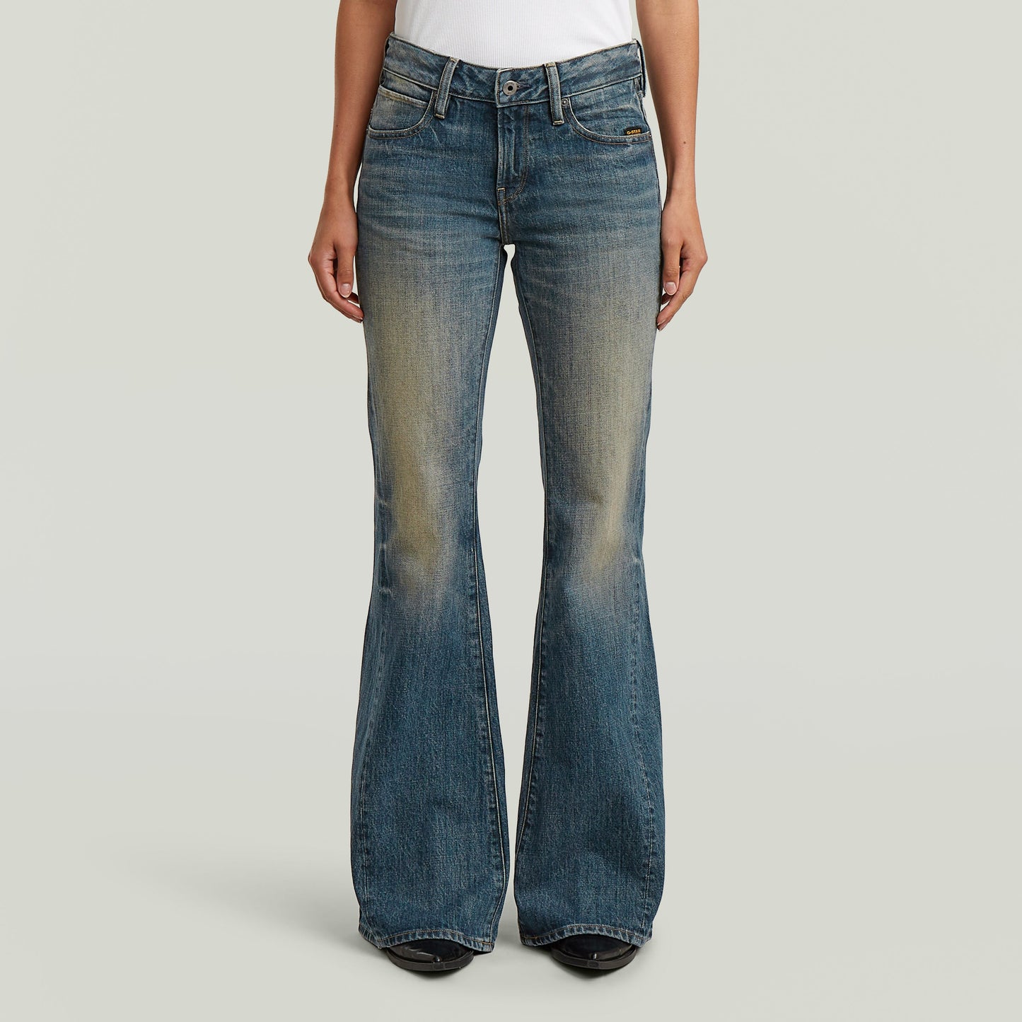 3D flare jeans for women in bootcut style with unique design and faded denim finish.