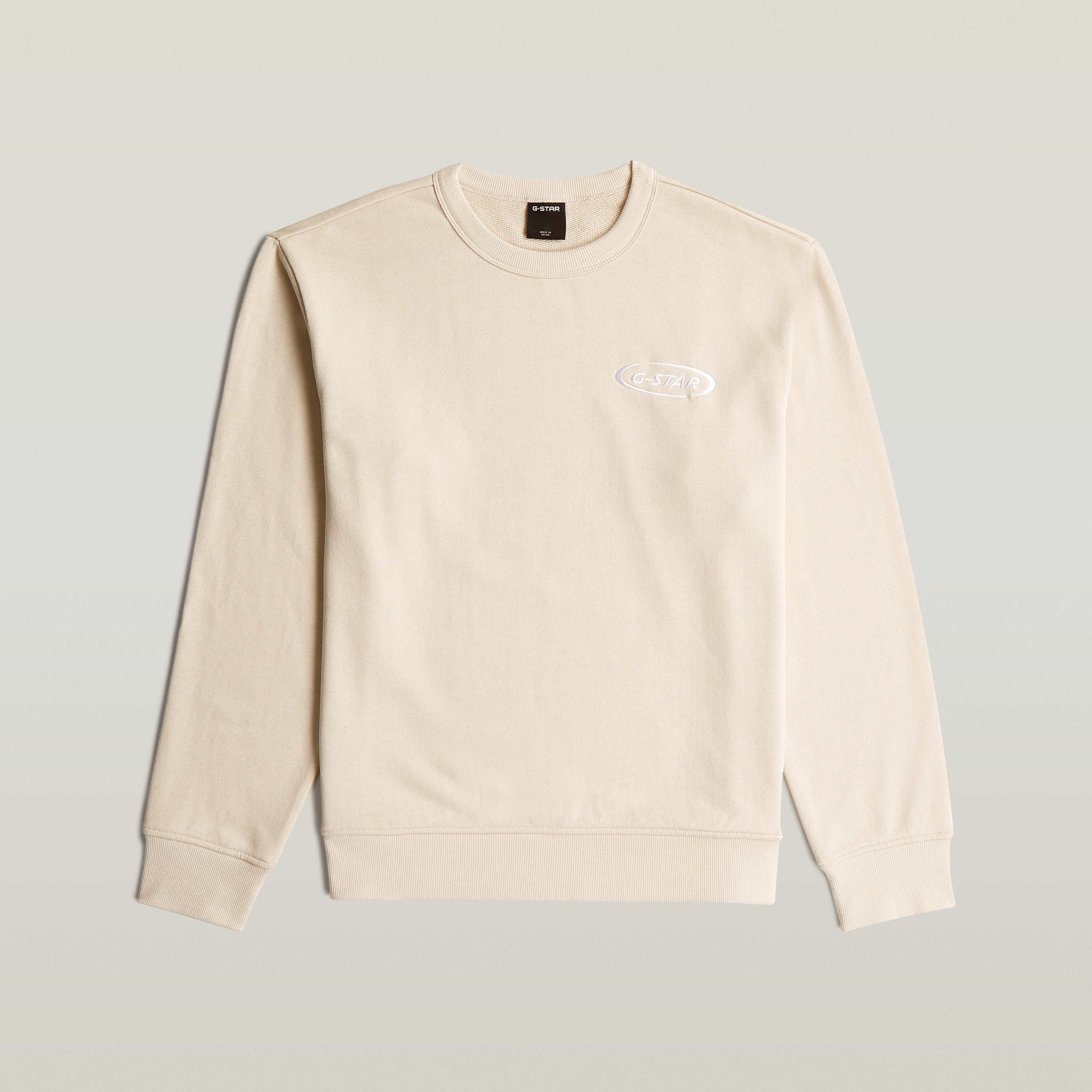 Sudadera con logotipo de los 90, color blanco, 100% algodón ecológico, diseño atemporal.