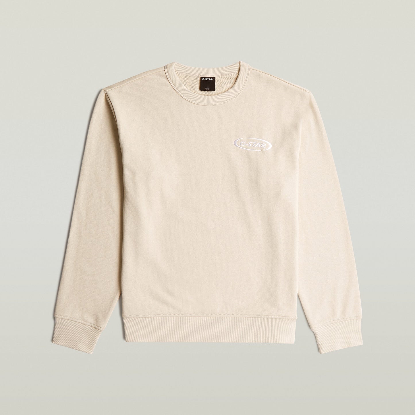 Sudadera con logotipo de los 90, color blanco, 100% algodón ecológico, diseño atemporal.