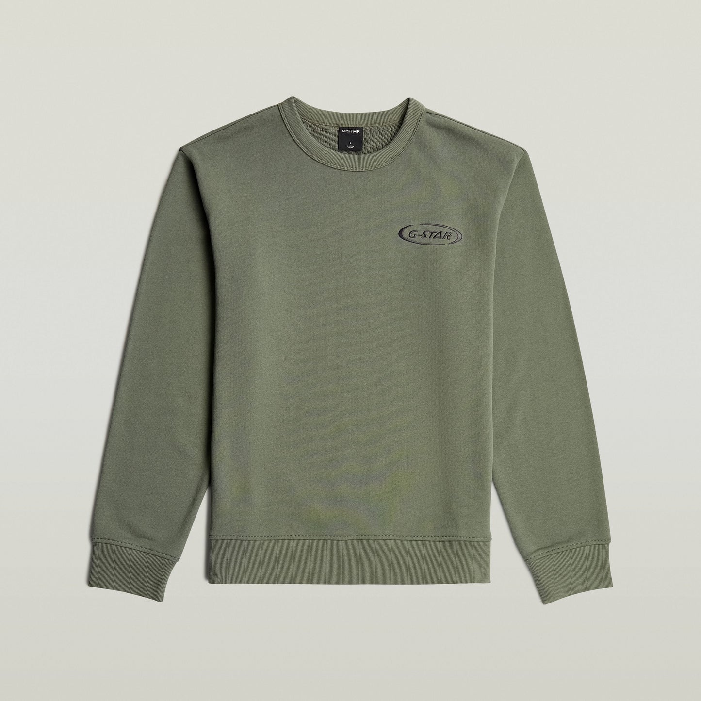 Sudadera con logotipo de los 90 en color verde, cuello redondo y diseño gráfico en el pecho.