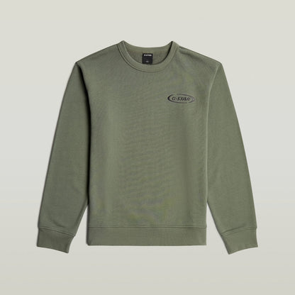 Sudadera con logotipo de los 90 en color verde, cuello redondo y diseño gráfico en el pecho.