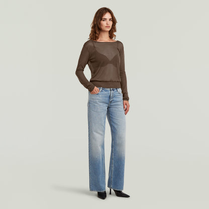 Jersey Sheer Summer El Sheer Summer Knit tiene fit regular, manga larga y un diseño liviano, ideal para usar en capas.