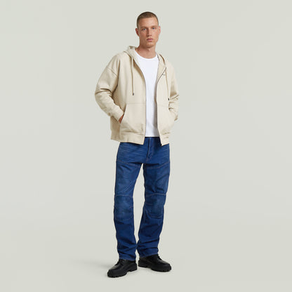 Sudadera Back Graphic Loose con Capucha y Cremallera El Back Graphic Loose Hooded Zip Sweater tiene fit holgado con capucha y cierre de cremallera, para un estilo relajado y casual.