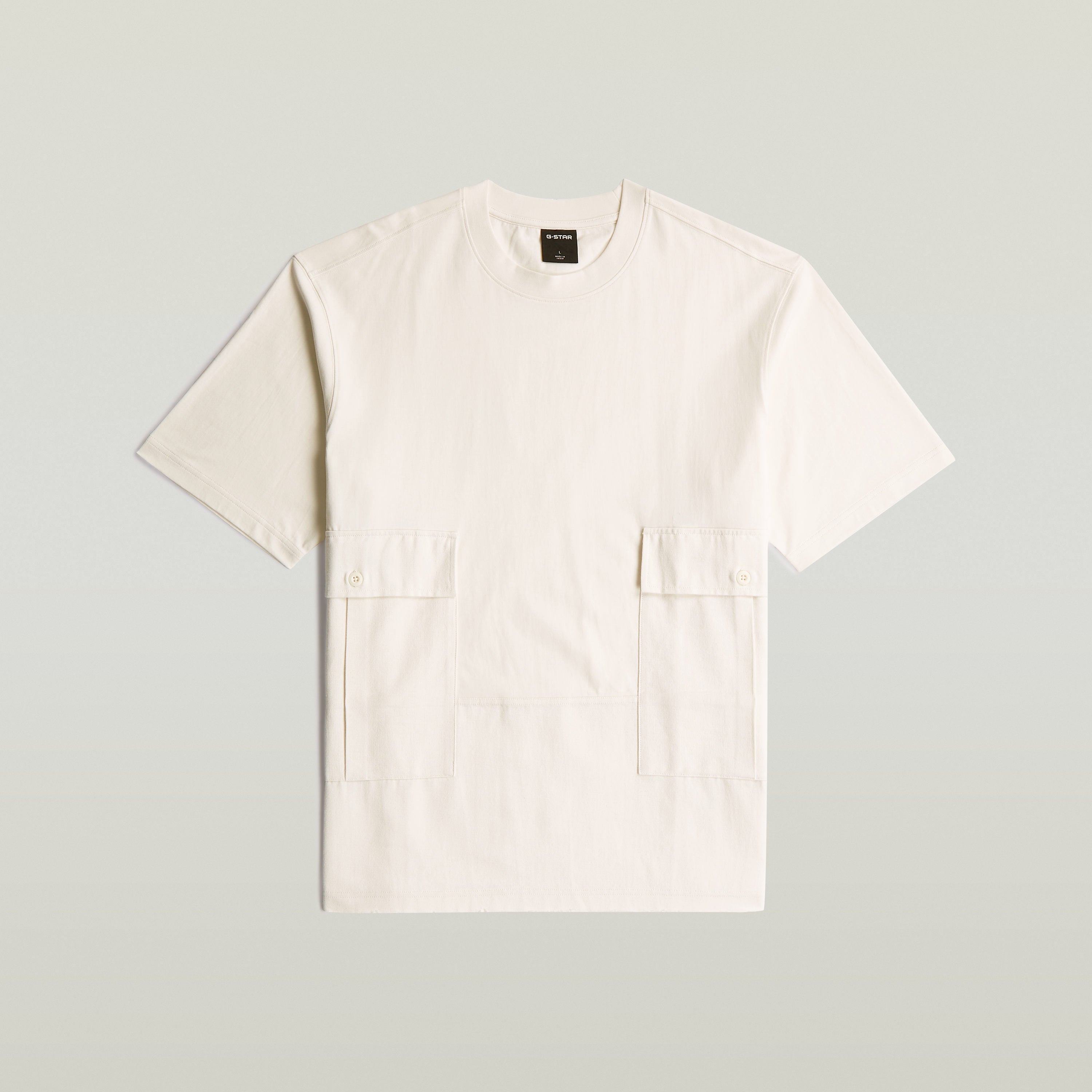 Camiseta Utility Fabric Mix blanca de algodón ecológico con corte suelto y detalles de bolsillos, utility fabric t-shirt.
