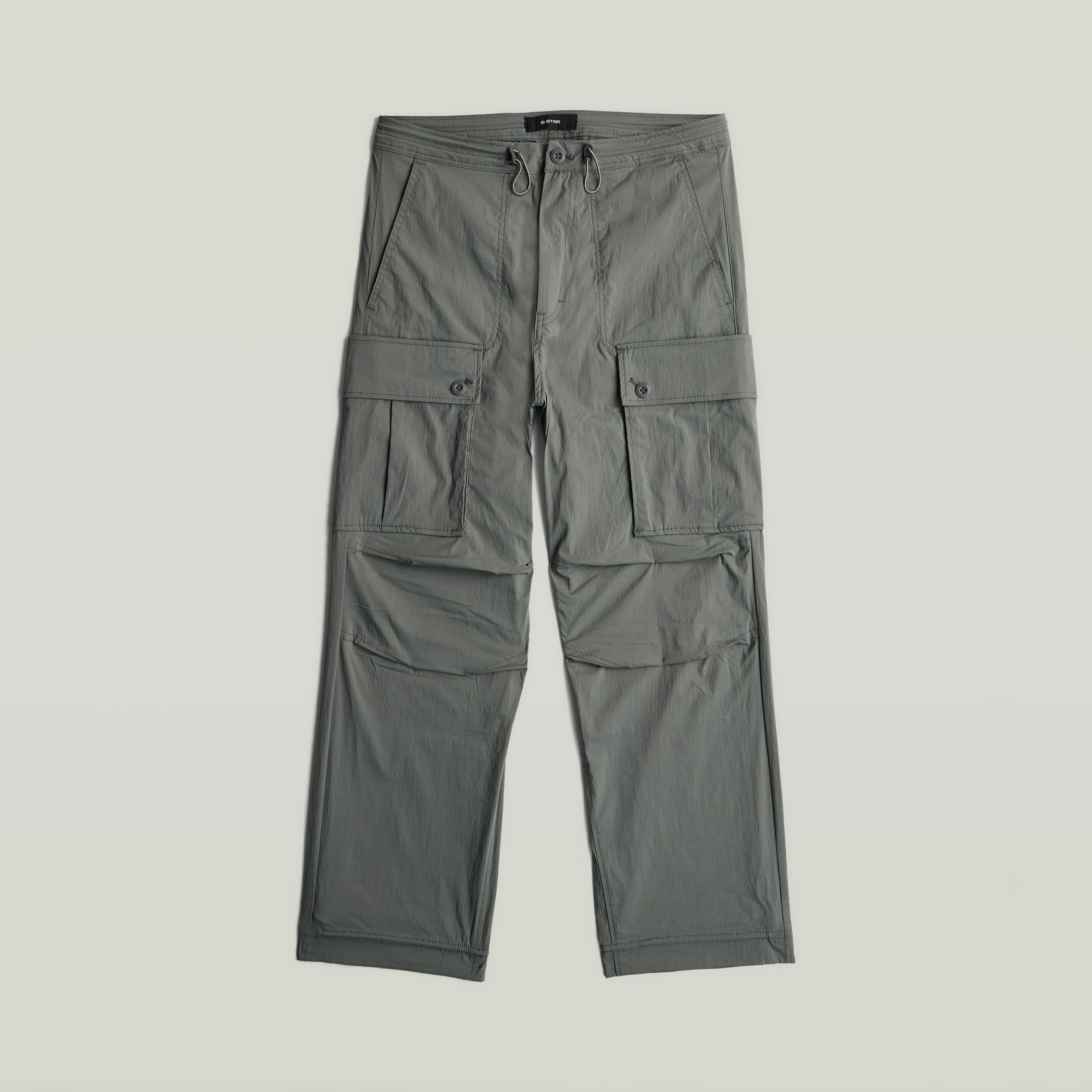Relaxed cargo pants in green with multiple cargo pockets and a loose fit design.