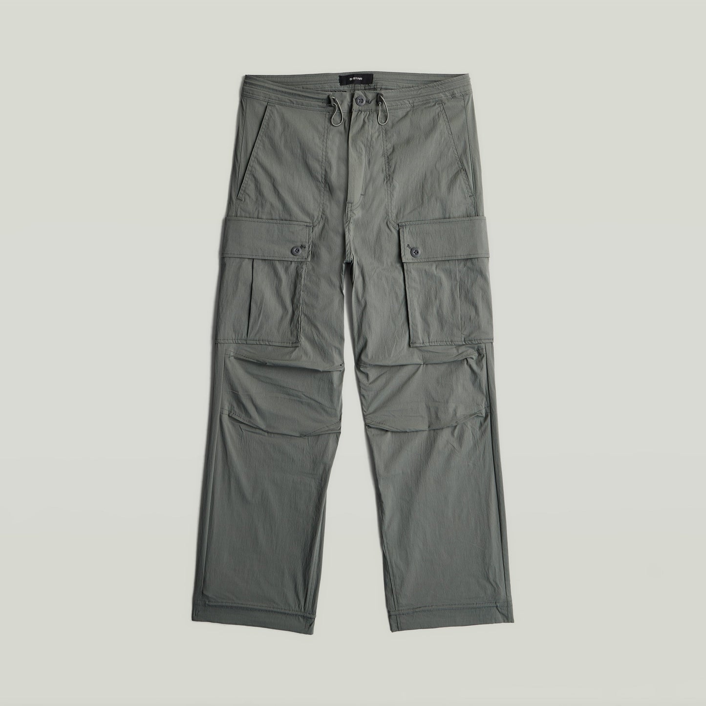 Relaxed cargo pants in green with multiple cargo pockets and a loose fit design.