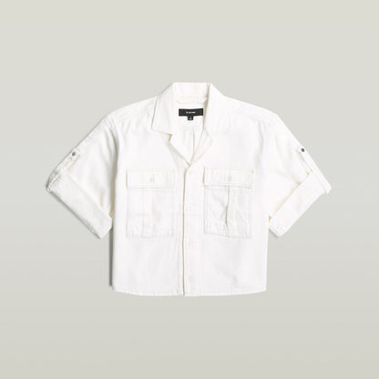 Camisa Boxy Relaxed en blanco, 100% algodón, con corte relajado, manga corta y cuello clásico, ideal como relaxed fit boxy shirt.