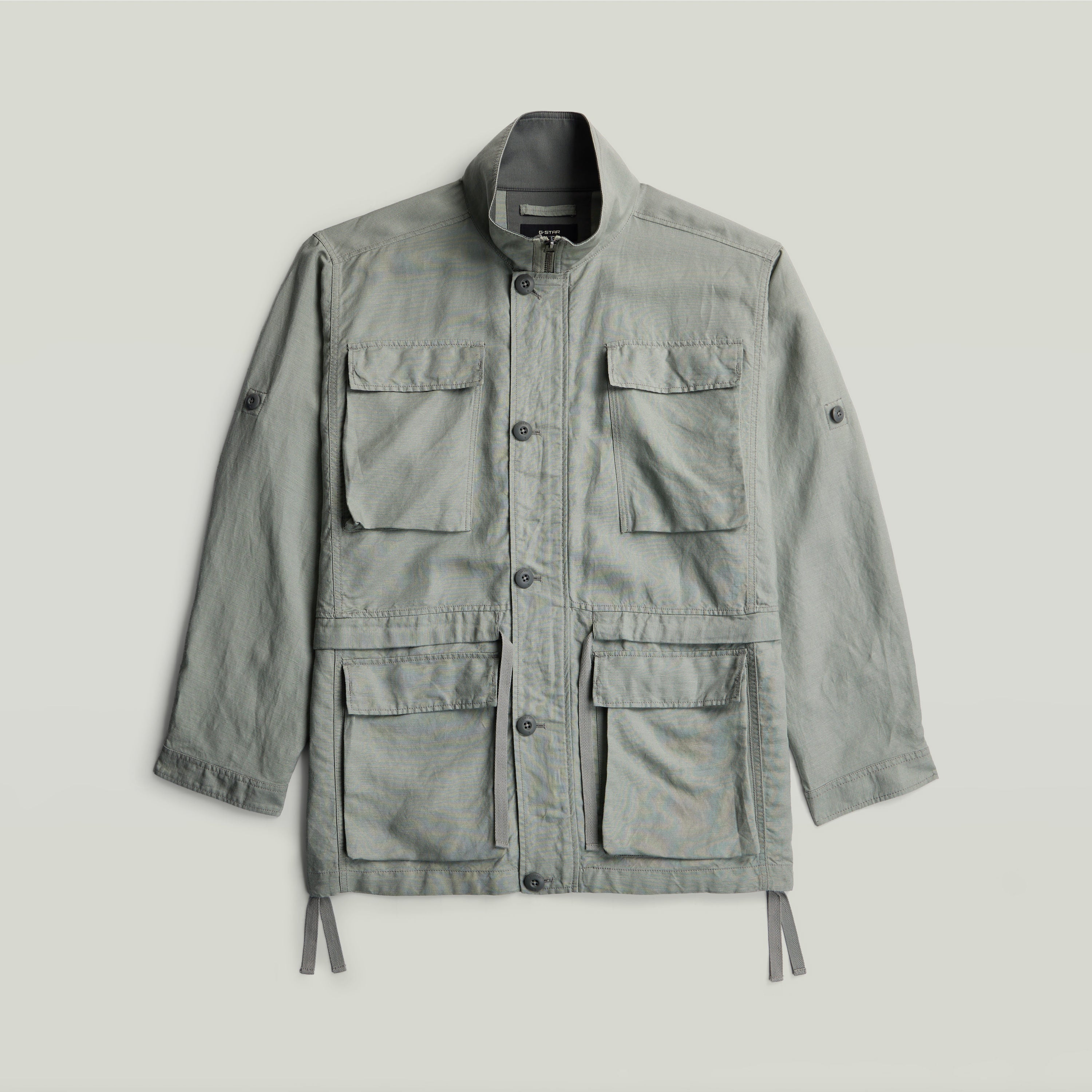 versatile field smock jacket in light green with multiple pockets and a structured design