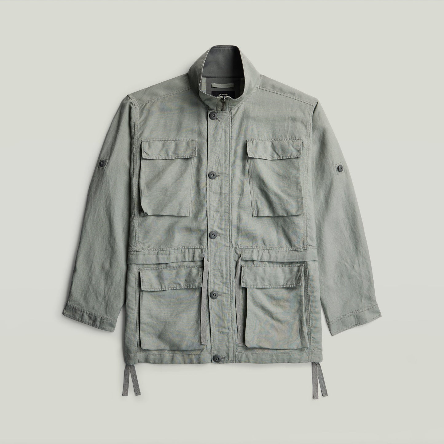 versatile field smock jacket in light green with multiple pockets and a structured design