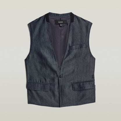 Chaleco Blazer ligero de denim en azul oscuro con corte recto y sin mangas, elegante y clásico.
