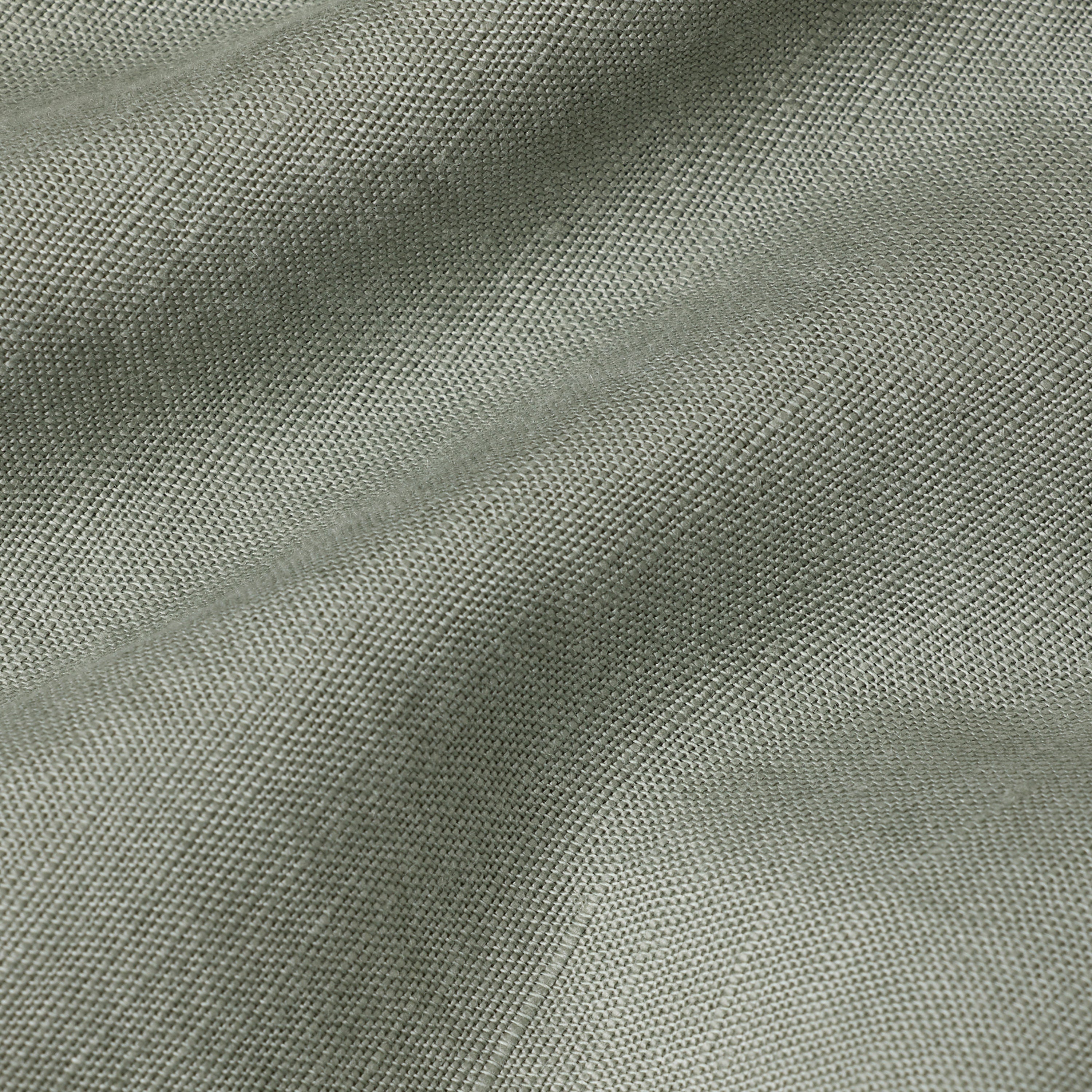 Summer chino pants fabric in a soft light green color, showcasing the lightweight and breathable material.