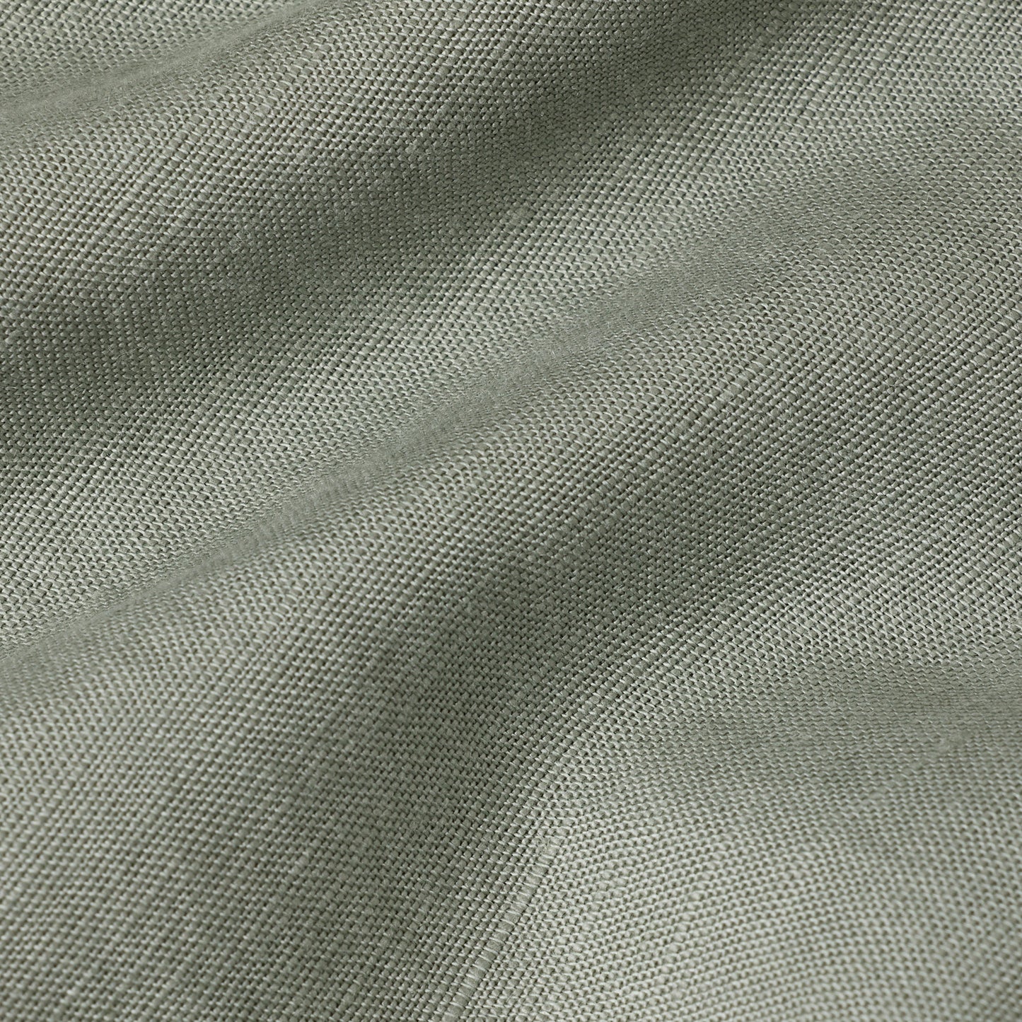 Summer chino pants fabric in a soft light green color, showcasing the lightweight and breathable material.