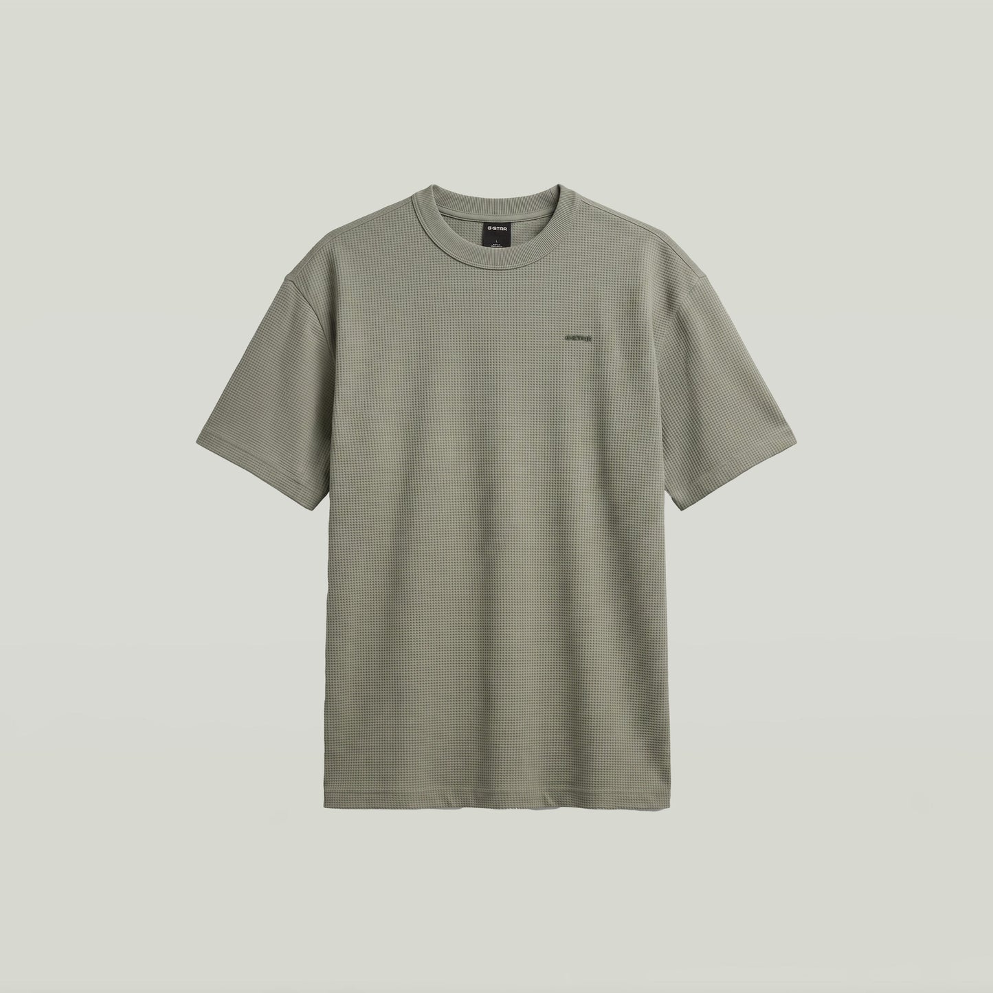 Camiseta Relaxed con textura en color verde, diseño gráfico y corte cómodo, verde textured relaxed t-shirt.