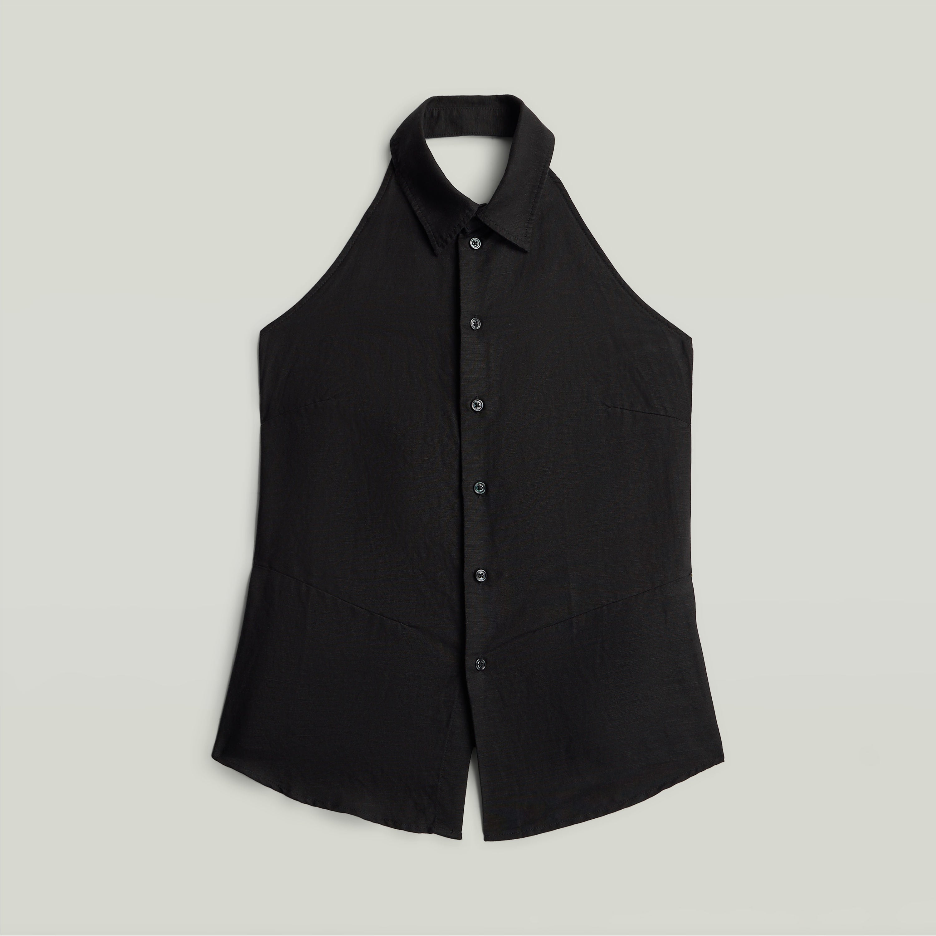 Halter neck top lightweight in black color with button closure and sleeveless design.