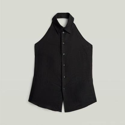 Halter neck top lightweight in black color with button closure and sleeveless design.