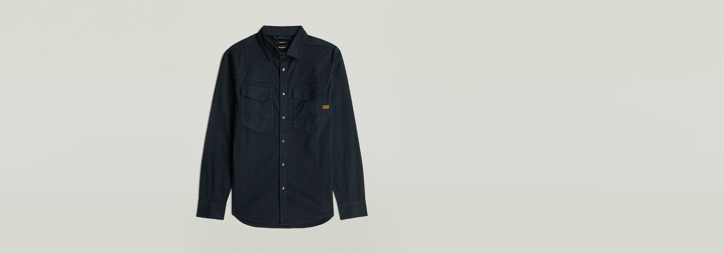 Camisa Dakota Slim en color negro, elegante y moderna, con cuello clásico y cierre de botones a presión.