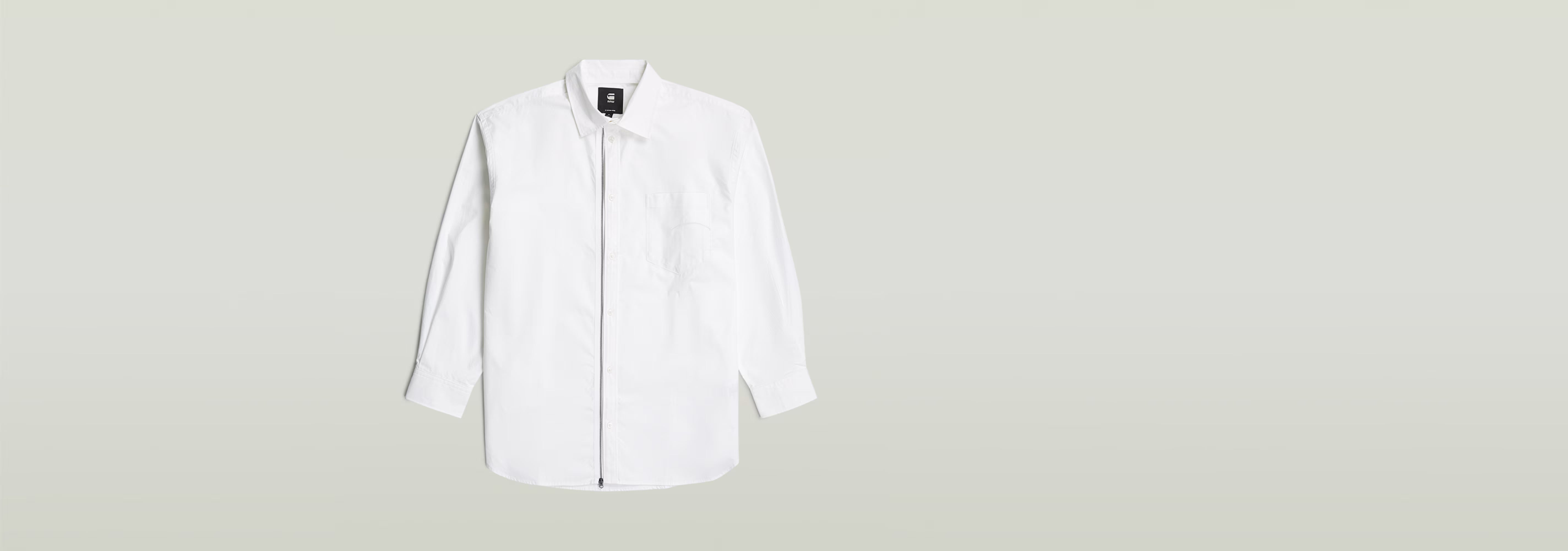 Camisa extragrande de popelín con cremallera en color blanco, con cierre de botón y cremallera, diseño moderno.
