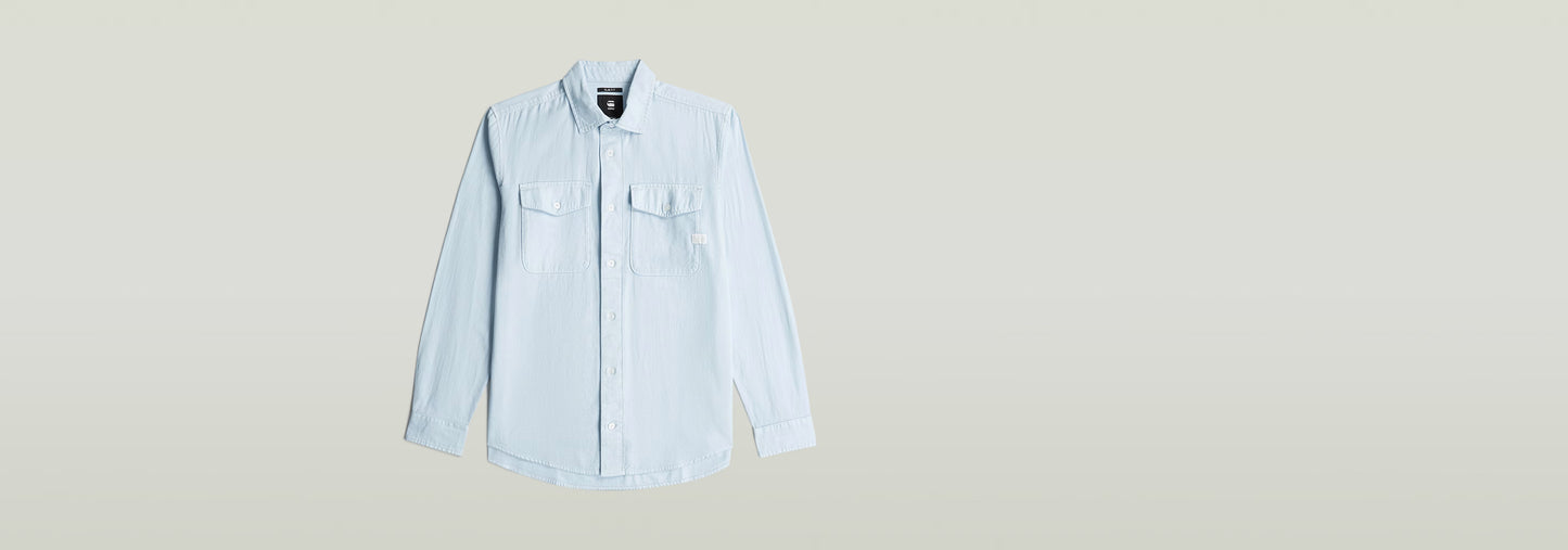 Camisa Marine Slim de corte ajustado con bolsillo en el pecho y cuello de camisa, color azul claro.