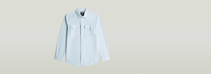 Camisa Marine Slim de corte ajustado con bolsillo en el pecho y cuello de camisa, color azul claro.