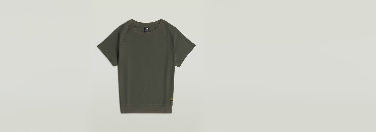 Camiseta Raglan en color verde oliva, con corte recto y mangas de casquillo, 100% algodón ecológico.