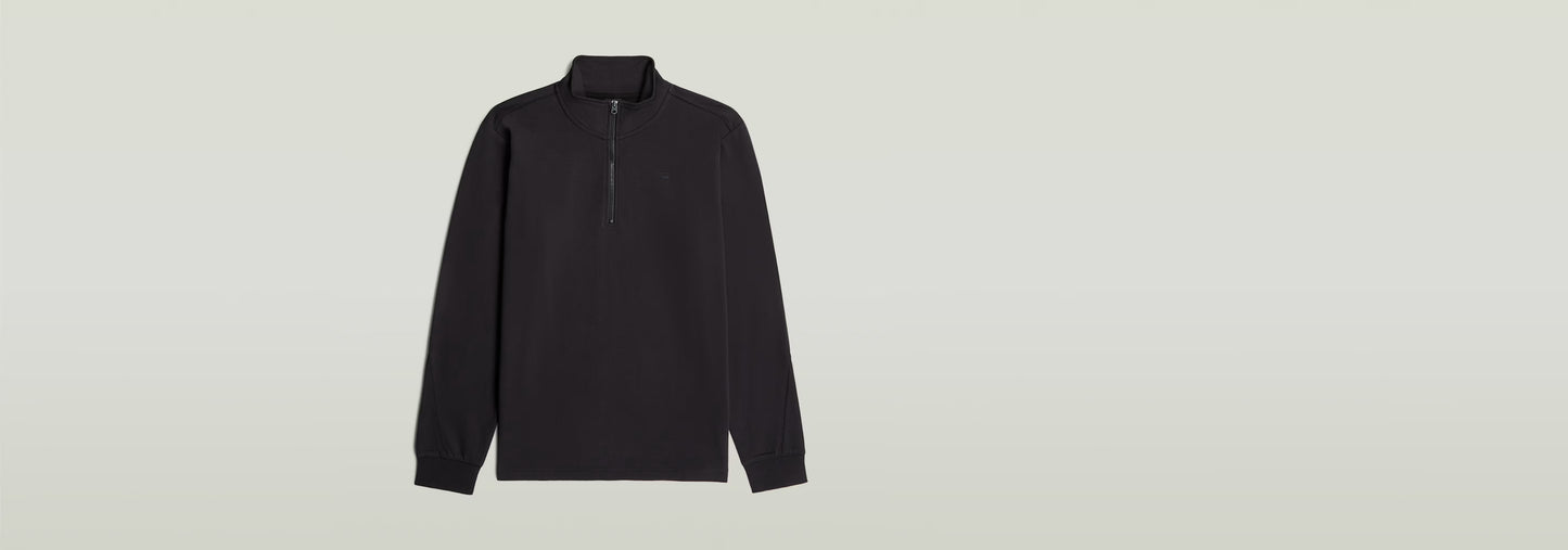 Camiseta Tweeter Half Zip Long Sleeve de manga larga con cuello alzado y cierre de cremallera, color negro.