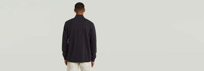Camiseta Tweeter Half Zip Long Sleeve vista posterior, diseño moderno, manga larga, color negro, estilo versátil.