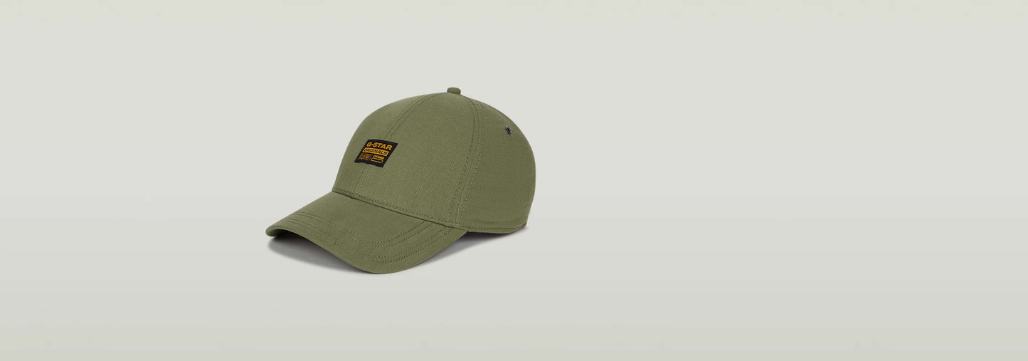 Gorra Originals Baseball color oliva con visera curvada y etiqueta G-STAR Originals en la parte delantera.