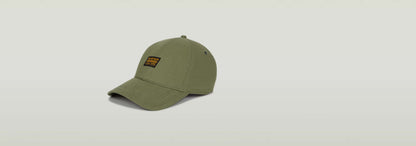 Gorra Originals Baseball color oliva con visera curvada y etiqueta G-STAR Originals en la parte delantera.