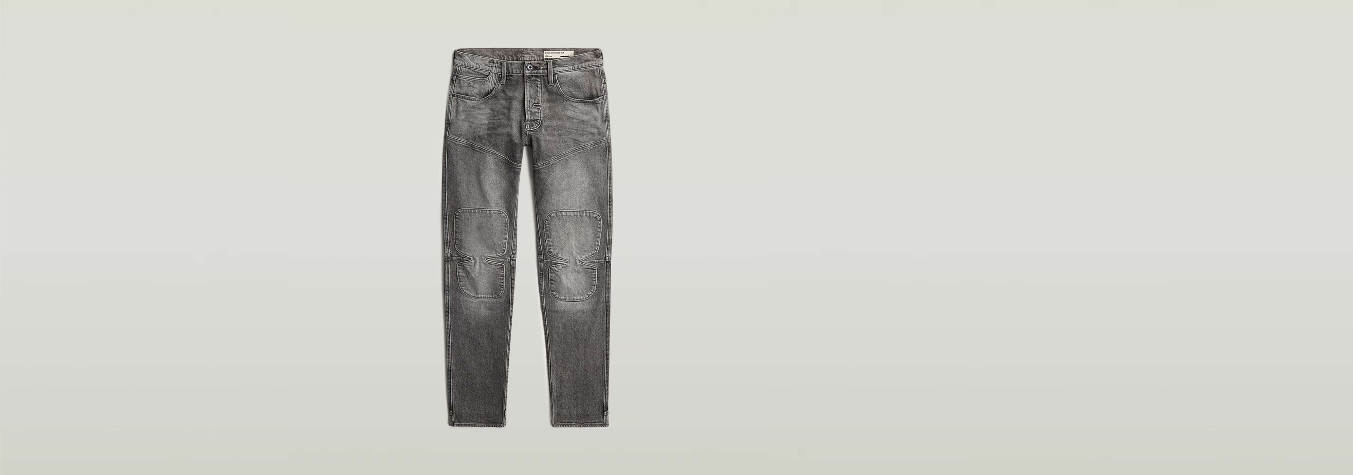 Jeans Biker Patched Slim en color gris con diseño 3D y parches, corte ajustado y rodillas articuladas.